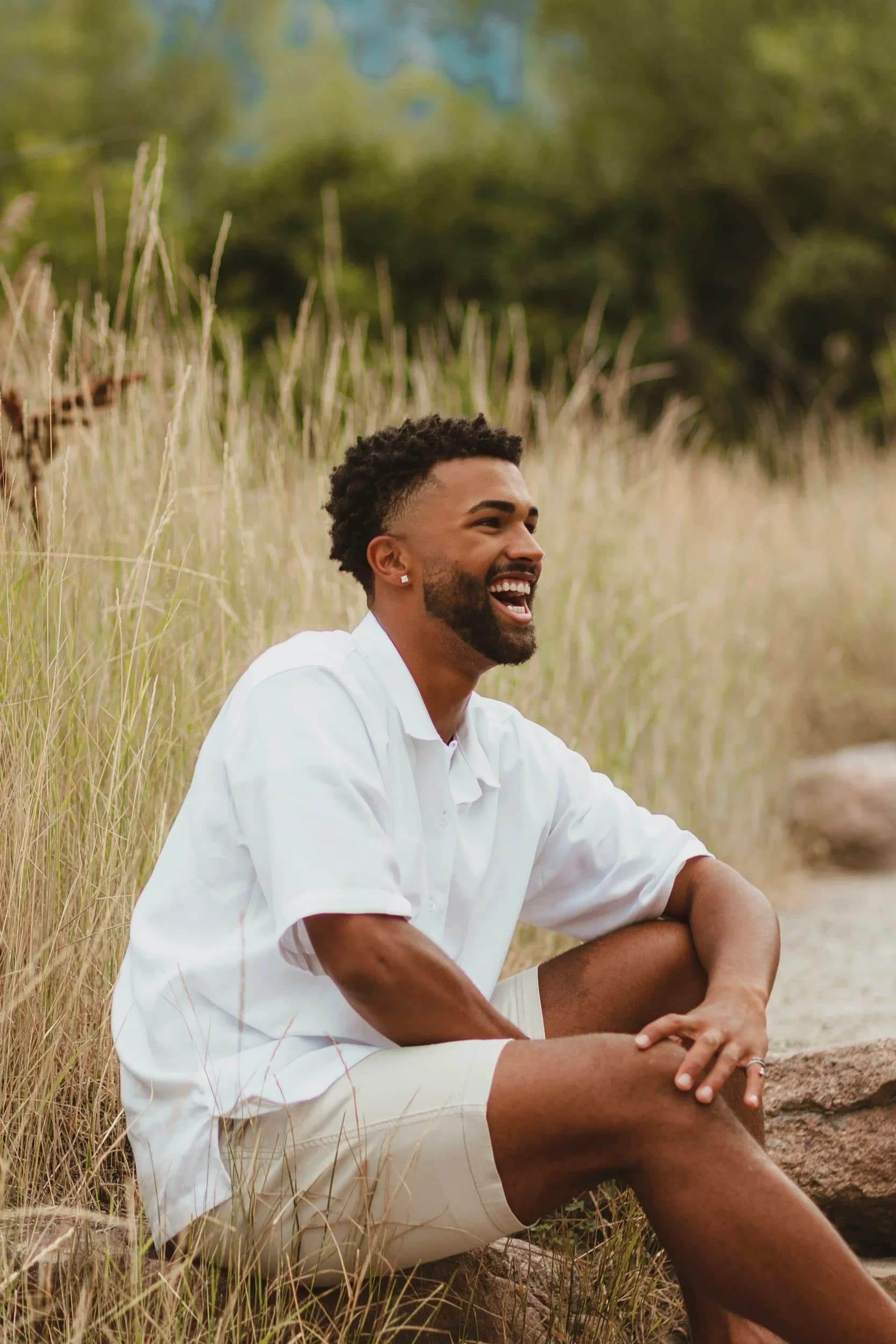 A man laughing joyfully outdoors — the feeling you can have after healing with Worthy Mind